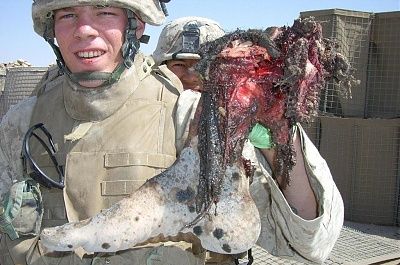 soldier-showing-off-trophy-01.jpg