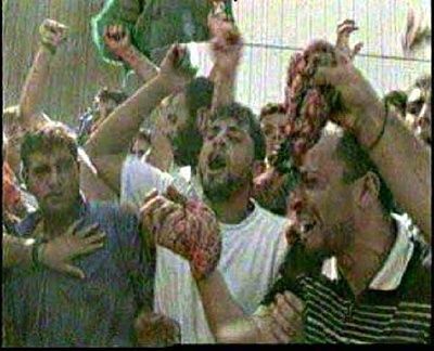 arabs-waving-entrails-butchered-israelis-ramallah.jpg