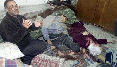 palestinian-survivor-sami-abda-sits-next-bodies-his-brother-jacoub-37-his-mother.jpg