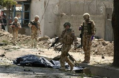 British_soldiers_pass_by_dead_bodies_after_bomb_blast_in_Kabul.jpg