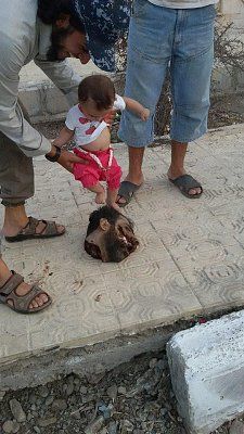 baby-stepping-severed-head.jpg