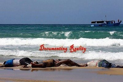 dead-african-immigrants-wash-up-beach-after-boat-sinks-1-qarboli-ly-aug-26-14.jpg