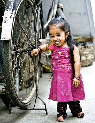 Jyoti Amge With Achondroplasia in Nagpur, India, 2008 - near bicycle