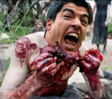 Luis-Suarez-likes-to-eat-players-e1.jpg