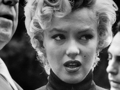 george-silk-marilyn-monroe-face-reporters-after-announcement-divorce-from-baseball-great-joe-dim.jpg
