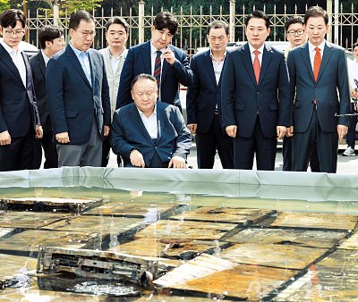 sad-20officials-20look-20at-20burnt-20servers.jpg