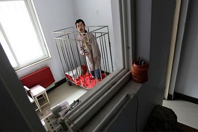 chinese-man-kept-cage-40-years-main-2921825.jpg