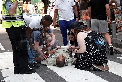 4080724200000578-4519432-an_injured_man_was_being_treated_on_the_ground_after_the_collisi-31_1.jpg