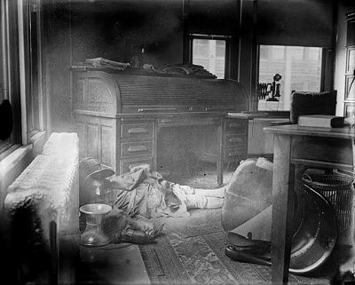 dead_woman_on_floor_with_chair_and_spittoon.jpg