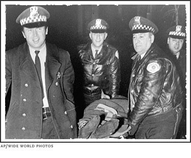 148147872-Cops_carry_Fred_Hampton.jpg