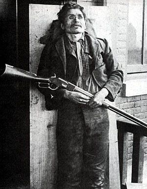creepy%20dead%20dude%20posed%20with%20rifle.jpg