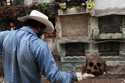 1410788107120_wps_22_a_grave_cleaner_holds_up_.jpg