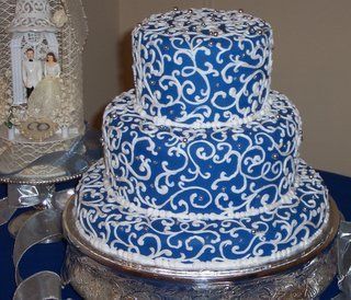 Sculpted Novelty Cakes: DeLorean, Pop Culture and Food Designs - scrolls & silver pearls on blue fondant wedding cake
