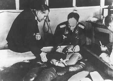 Dr. Rascher (on the right) conducting a freezing experiment.jpg