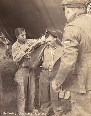 Liberated Russian prisoner is deloused with DDT.jpg