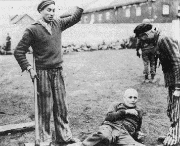 Two prisoners prepare to beat one of the guards.gif