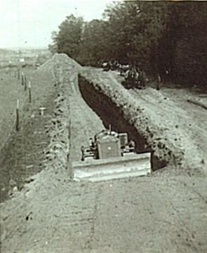 US Army bulldozer digging trench for mass graves at Leitenberg.jpg