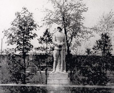 abandoned-death-train-behind-world-war-i-memorial-statue.jpg