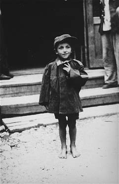 child-survivors-stands-front-barracks-newly-liberated-ebensee-concentration-cam.jpg
