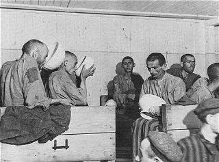 Liberated prisoners at the Ebensee camp. Too weak to eat solid food, they drink a thin soup prep.jpg