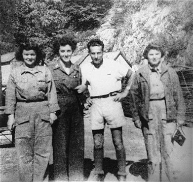 Nurses from the U.S. Army 30th Field Hospital with Adolf Burger, a survivor, in the Ebensee conc.jpg
