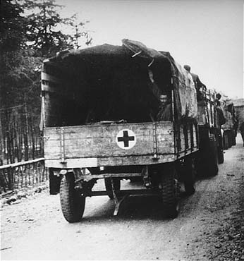 Survivors from Ebensee are evacuated to the 139th Evacuation Hospital for medical treatment.jpg