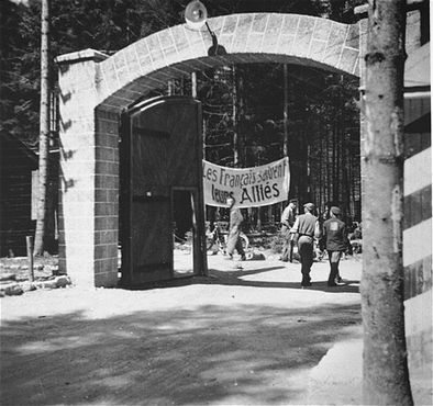 View of the main gate at the Ebensee concentration camp. The sign just beyond it reads- The Fren.jpg