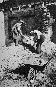 Two Jewish men at forced labor clearing rubble in Konskowola.jpg