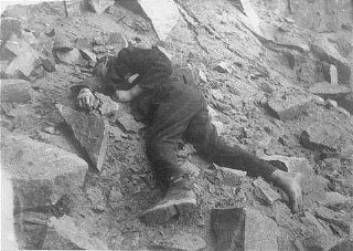 A Soviet inmate lies dead in the Mauthausen concentration camp quarry.jpg