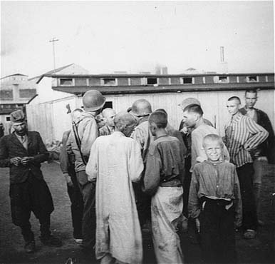 Mauthausen survivors in the 'Russian camp' greet American soldiers.jpg