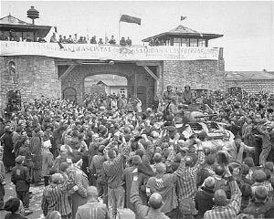 Survivors of Mauthausen cheer American soldiers as they pass through the main gate.jpg