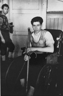 A handicapped youth sitting in a wheelchair.jpg