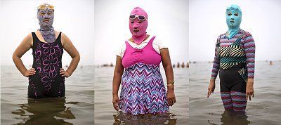 chinese-women-pose-facekinis-yellow-sea-aug.-21.-masks-locally-designed.jpg