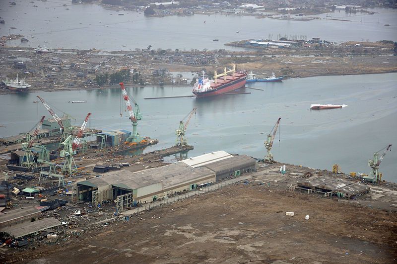 800px-US_Navy_110320-N-OB360-166_An_aerial_view_of_ships_washed_ashore_and_overturned_at_a_port_.jpg