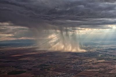 distant-storm-cloud-seen-airplane-window.jpg