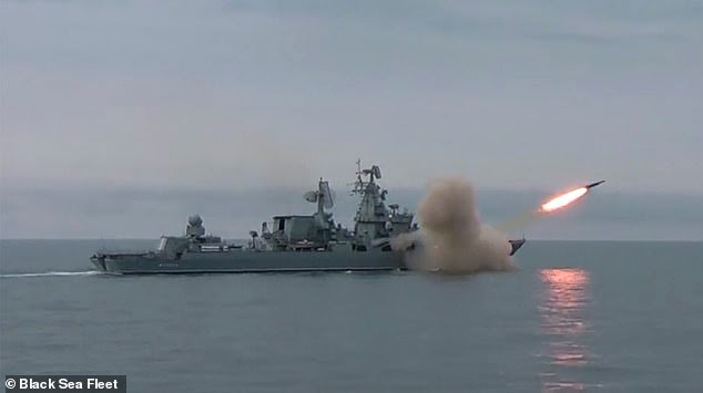 56590641-10717065-Pictured_The_Moskva_missile_cruiser_fires_a_missile_during_a_tra-m-56_16498957.jpg