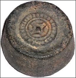 Picture62+Round+shaped+tin+ingot+decorated+with+Chinese+coin+pattern+found+in+Malacca.jpg