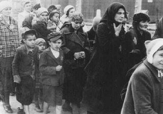 Hungarian Jews on their way to the gas chambers. Auschwitz-Birkenau, Poland, May 1944.jpg