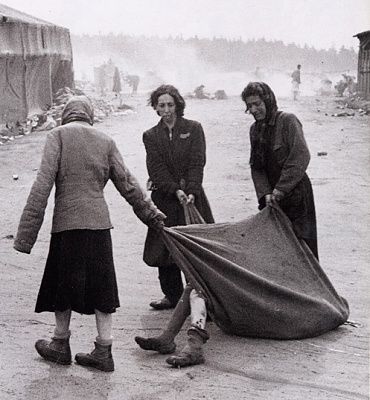 bergen-belsen-inmates-drag-diseased-body-using-blanket.jpg