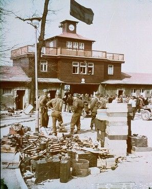 Americans stacked German weapons at the gate house, April 1945.jpg