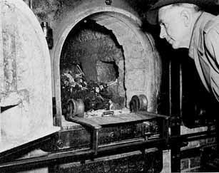 Buchenwald Concentration Camp Liberation Photos Near Weimar, Germany, 1945 - Congressman Ed Izac views burned remains in ovens