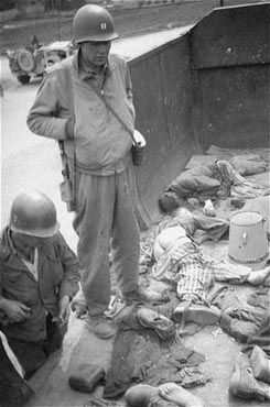 American soldiers view the bodies in one of the open railcars of the Dachau death train2.jpg