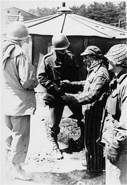 survivor of Kaufering IV, one of the Dachau subcamps in the Landsberg-Kaufering area, with Ameri.jpg
