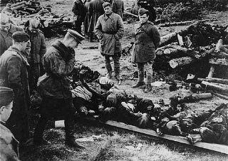 Klooga Concentration Camp Massacre in Estonia, September 19, 1944 - At the Klooga concentration camp, Soviet soldiers examine the bodies of victims left by the retr