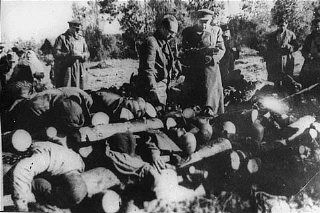 Klooga Concentration Camp Massacre in Estonia, September 19, 1944 - Soviet officials view stacked corpses of victims at the Klooga camp