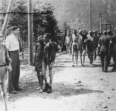Ebensee Concentration Camp in Austria: Liberation, May 6, 1945 - Emaciated survivors walk along a road in the newly liberated Ebensee concentration camp