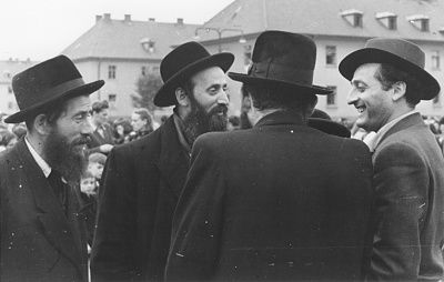 group-religious-jewish-men-converse-outside-bergen-belsen-displaced-persons-camp.jpg