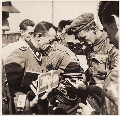british-soldiers-inspect-documents-former-ss-guards-bergen-belsen-concentration-camp.jpg