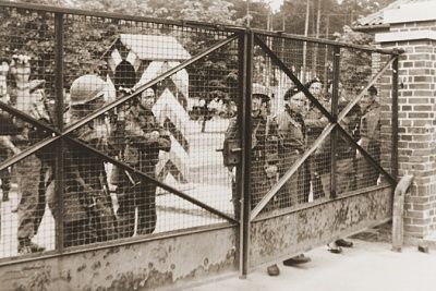 british-soldiers-stand-guard-outside-closed-gates-bergen-belsen-displaced-persons-cam.jpg