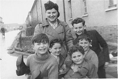 jdc-relief-worker-sally-wideroff-poses-group-orphaned-children-bergen-belsen-di.jpg